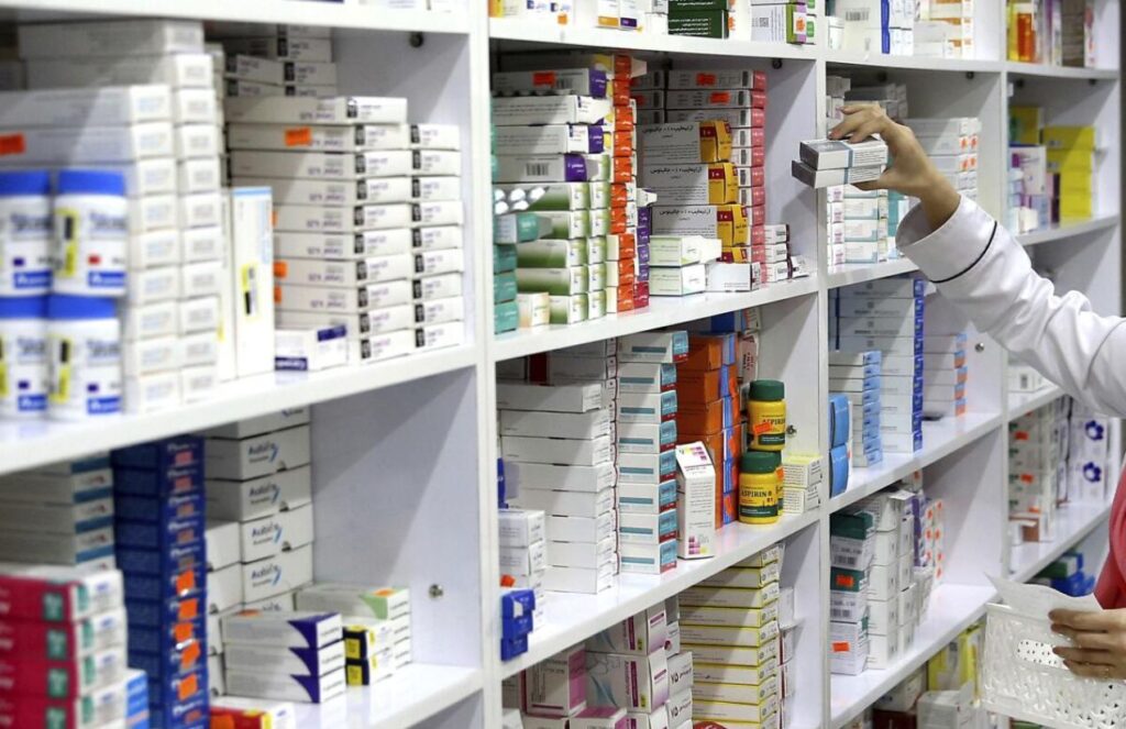 A shelf in a U.S. drugstore filled with many medications displayed on it