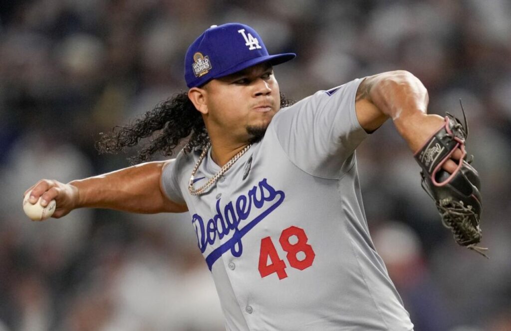 Graterol with his iconic long hair, about to throw a pitch from the mound