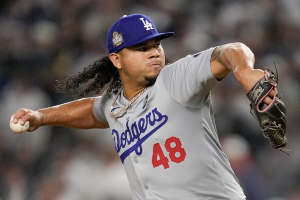 Graterol with his iconic long hair, about to throw a pitch from the mound