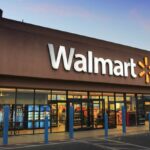 A Walmart store shown from the front with its well-known white logo