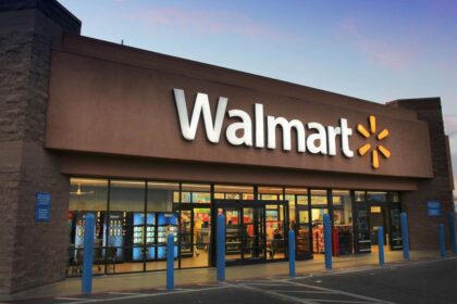 A Walmart store shown from the front with its well-known white logo