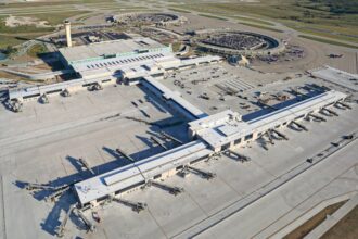 A panoramic aerial view of Kansas City Airport with its terminals and airplanes