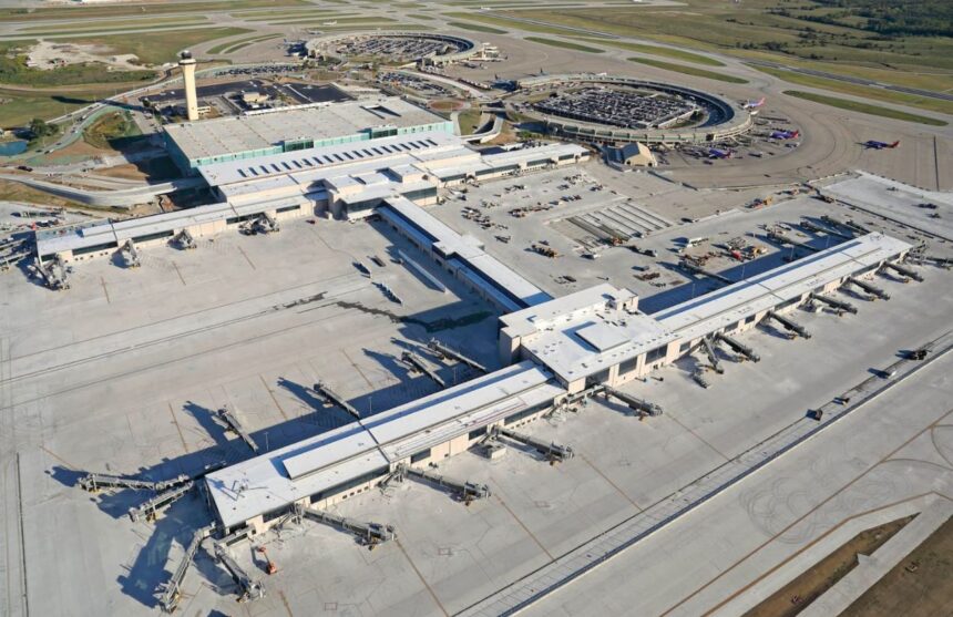 A panoramic aerial view of Kansas City Airport with its terminals and airplanes