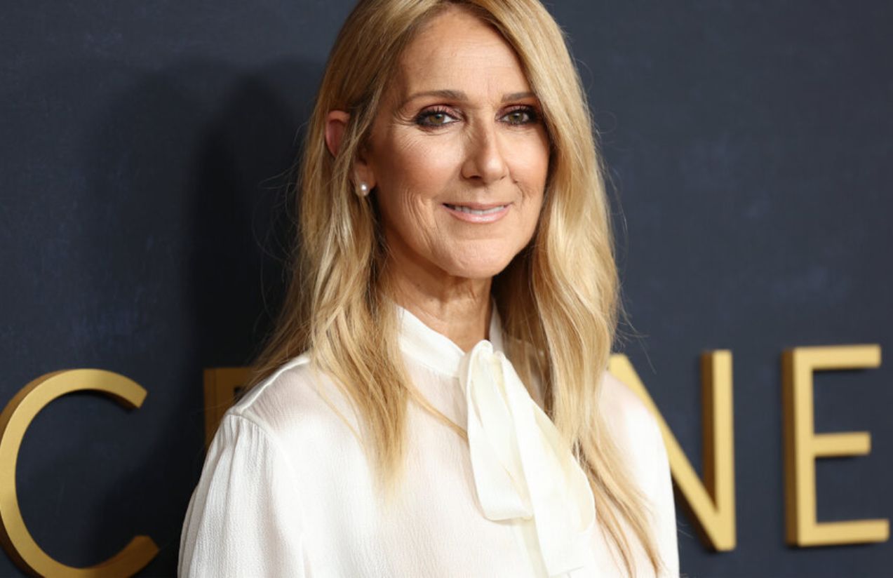 Celine Dion posing on a red carpet before one of her concerts