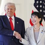 The U.S. president and the Japanese prime minister happily shaking hands for a photo