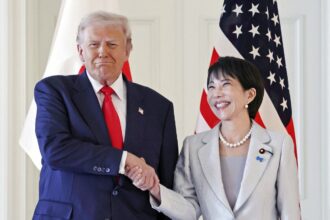 The U.S. president and the Japanese prime minister happily shaking hands for a photo