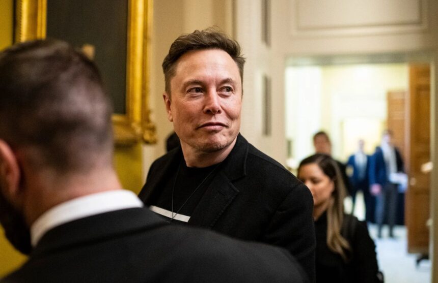 Elon Musk walking with a smile in what appears to be the White House