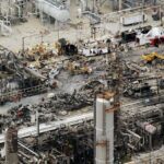 Destruction, chaos, and many burned and charred objects after the massive fire that occurred at the refinery