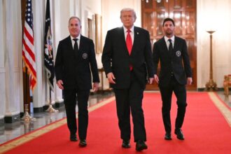 Trump giving Messi and another Inter Miami representative a tour of the White House while they wear elegant suits