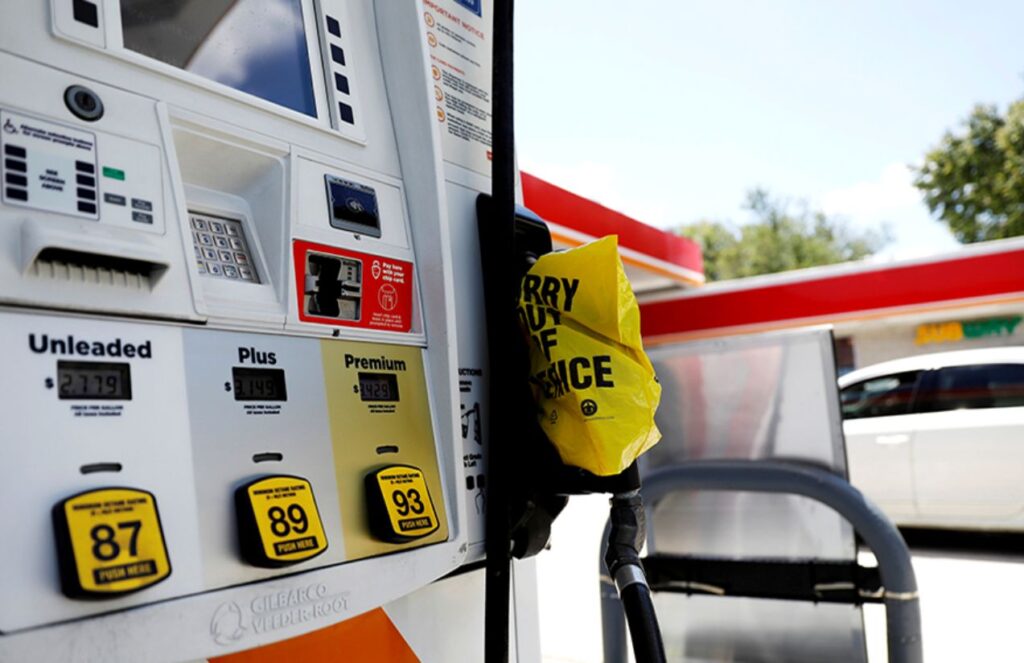 A gas station in the United States in white and orange colors