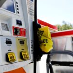 A gas station in the United States in white and orange colors