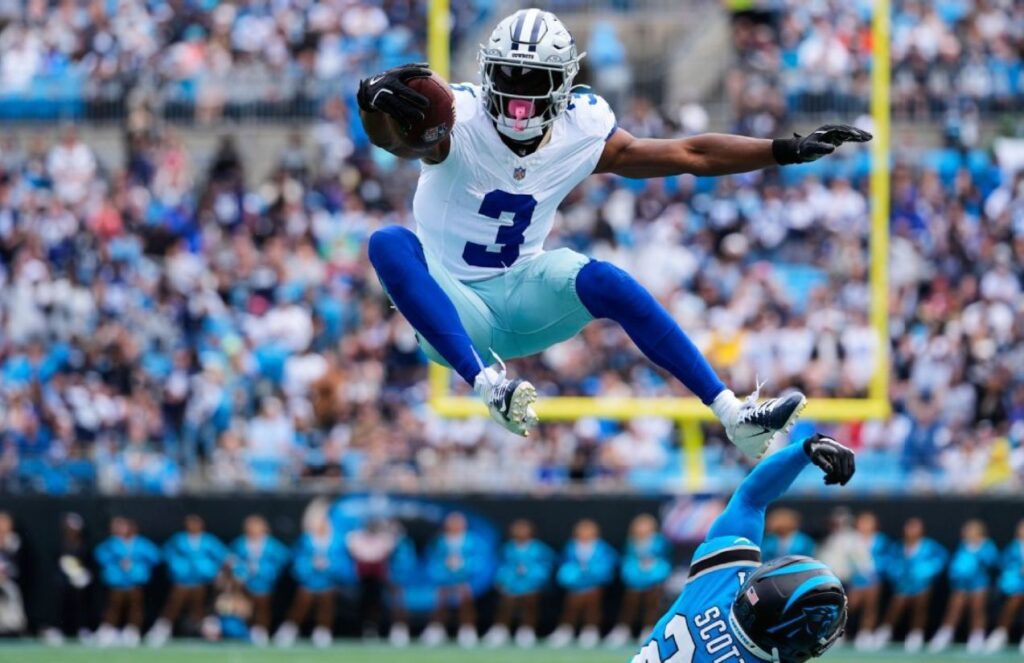 the famous Cowboys wide receiver jumping over one of his opponents during an official season game