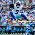 the famous Cowboys wide receiver jumping over one of his opponents during an official season game