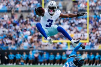 the famous Cowboys wide receiver jumping over one of his opponents during an official season game