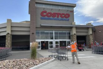 A Costco store seen from the outside with its iconic red color