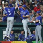The Italian team celebrating together after scoring several runs against Team USA