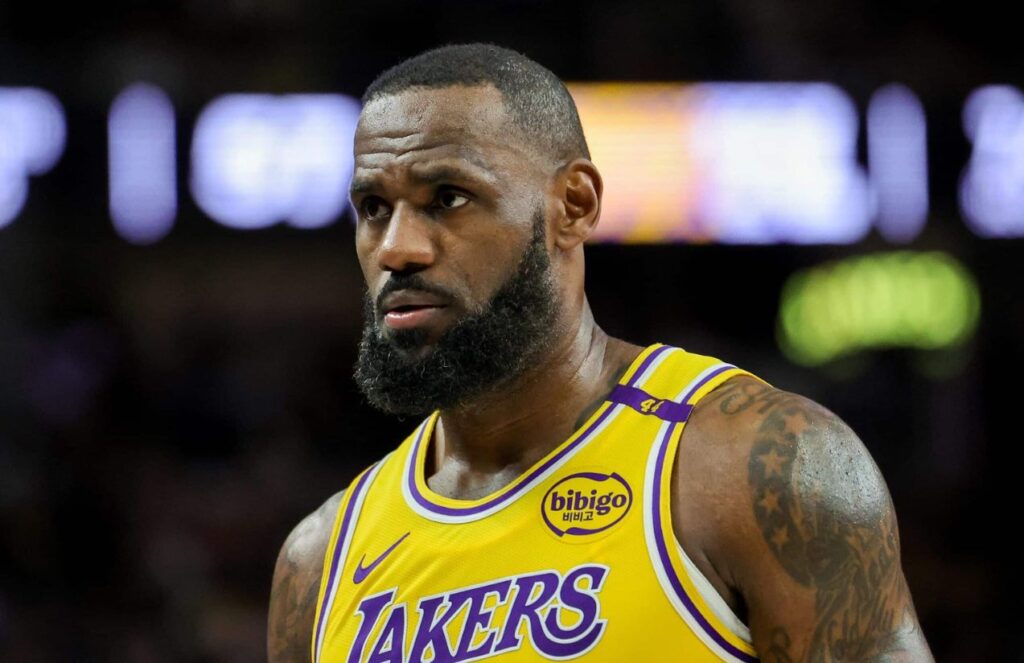 LeBron James with a very serious expression walking in the middle of a game