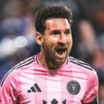 Messi euphorically celebrating a goal with some of his teammates