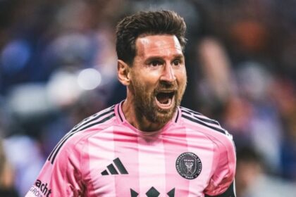 Messi euphorically celebrating a goal with some of his teammates