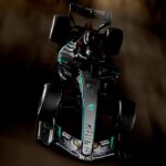 A Formula 1 Mercedes-Benz car with a Japanese dragon drawing on its front wings