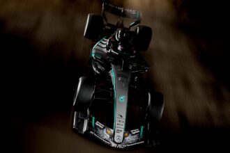 A Formula 1 Mercedes-Benz car with a Japanese dragon drawing on its front wings