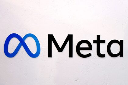 A wall with the logo and the word "Meta" in black