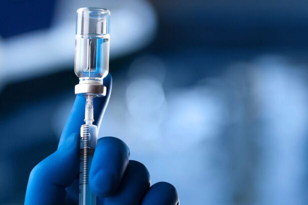 A medical worker drawing a vaccine into a syringe to administer it