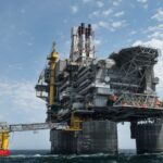 An oil platform in the middle of the sea