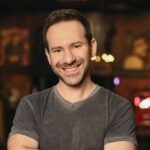 The late CEO of OnlyFans posing for the cameras, smiling and in good spirits