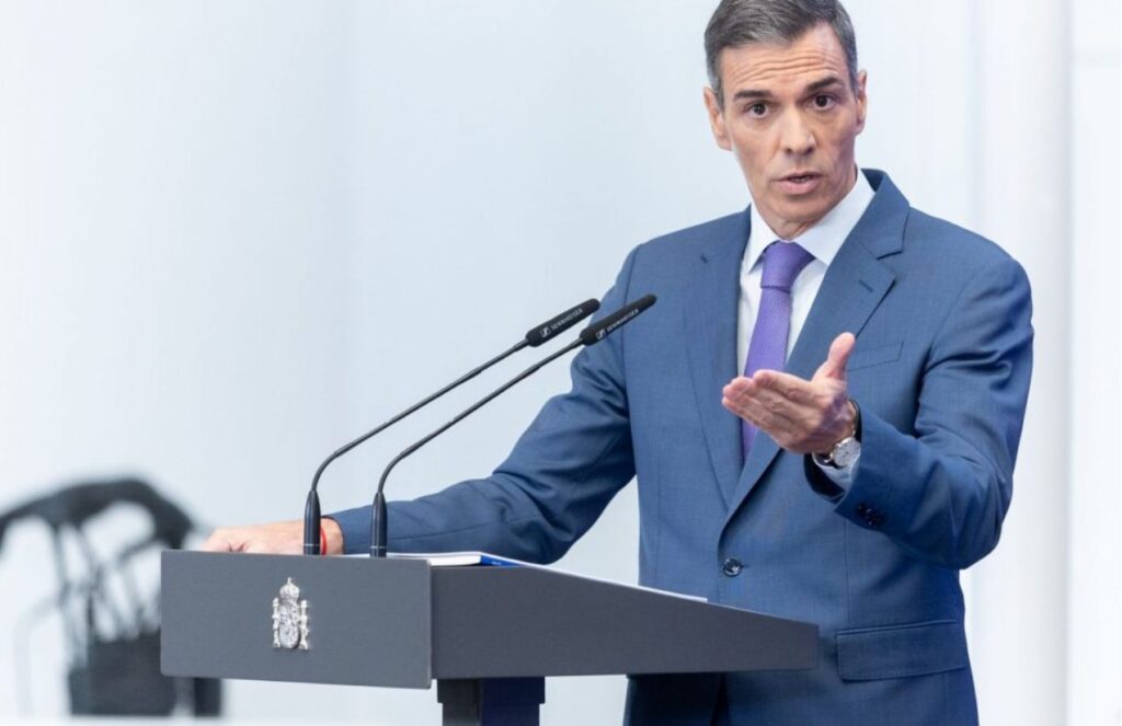 The leader of Spain speaking and delivering a speech in front of his supporters and colleagues
