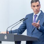 The leader of Spain speaking and delivering a speech in front of his supporters and colleagues