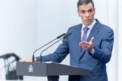 The leader of Spain speaking and delivering a speech in front of his supporters and colleagues