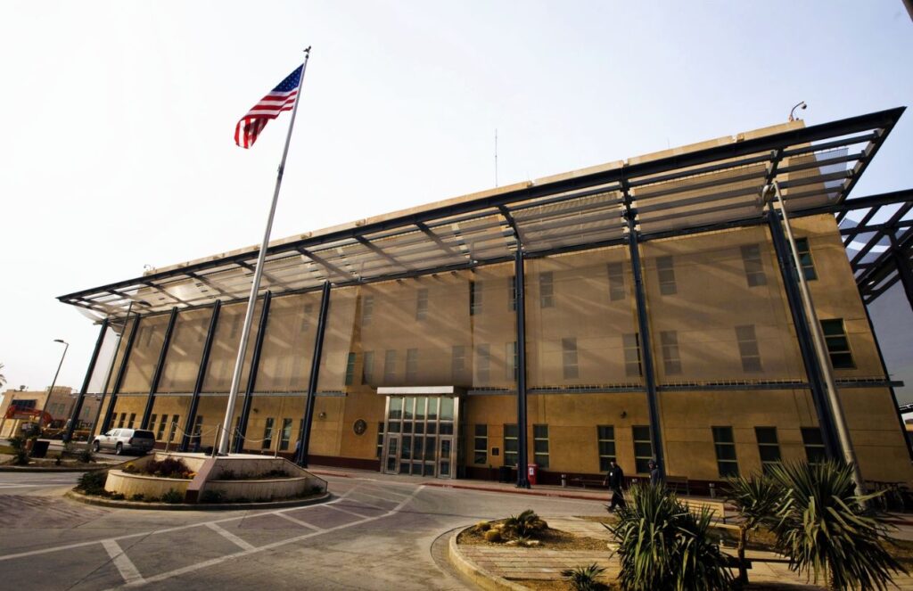 A frontal view of the United States embassy in yellow color