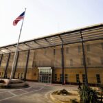 A frontal view of the United States embassy in yellow color