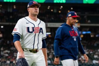 Skubal leaving the field with one of his coaches after delivering a magnificent performance with Team USA