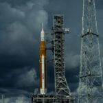 A yellow NASA rocket waiting for the launch signal on a very cloudy day