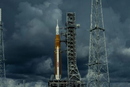 A yellow NASA rocket waiting for the launch signal on a very cloudy day