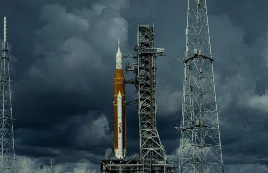 A yellow NASA rocket waiting for the launch signal on a very cloudy day