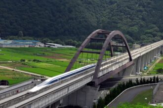 A train passing over a bridge in Japan