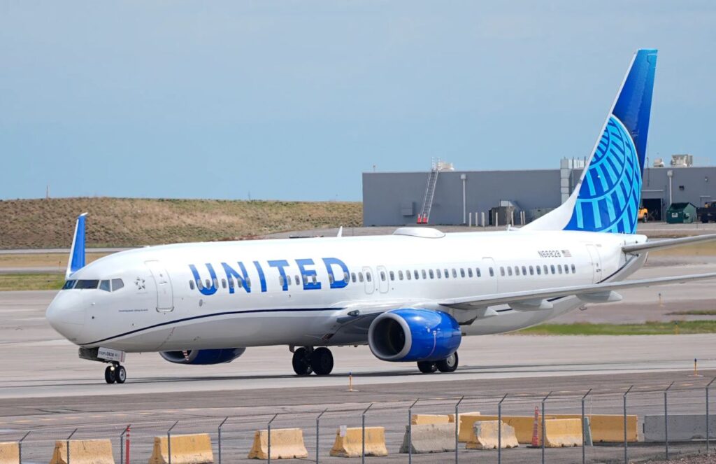 A United Airlines airplane parked at an airport