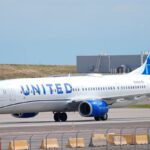A United Airlines airplane parked at an airport