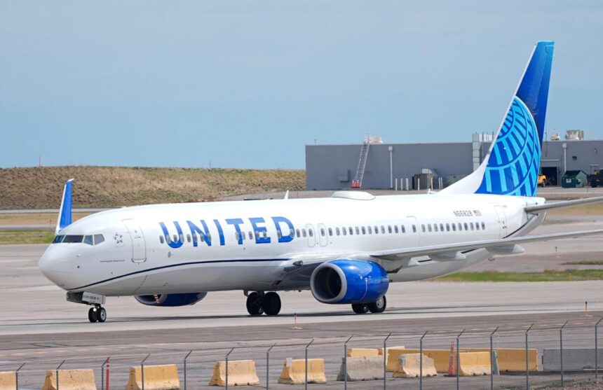 A United Airlines airplane parked at an airport