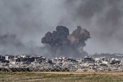 A war zone with heavy destruction and explosions everywhere