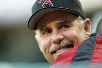 The MLB legend looking toward the horizon while smiling