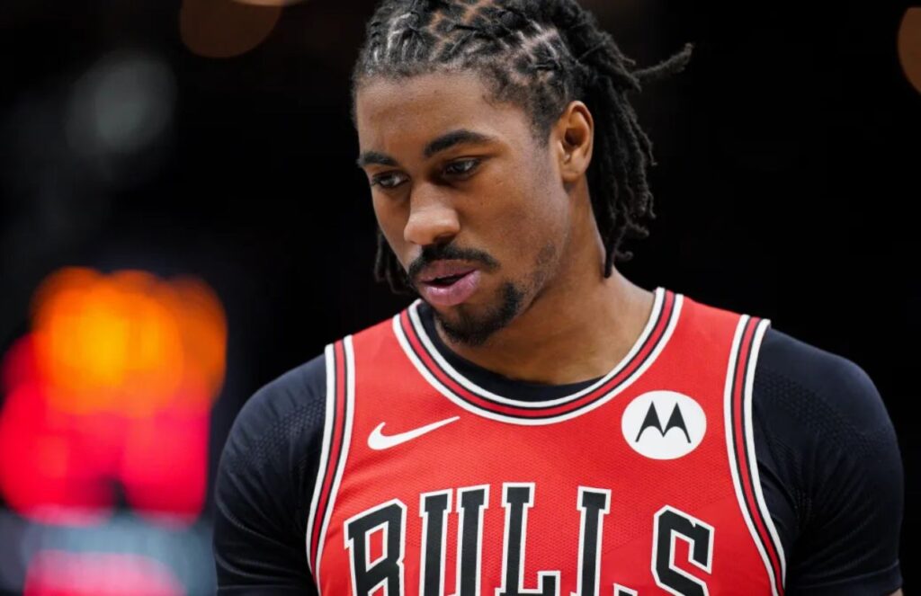 Jaden wearing a Bulls jersey with a very sad expression in the middle of a game