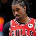 Jaden wearing a Bulls jersey with a very sad expression in the middle of a game