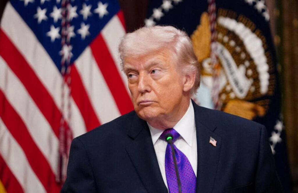 Donald Trump staring intently at someone during one of his presidential speeches.