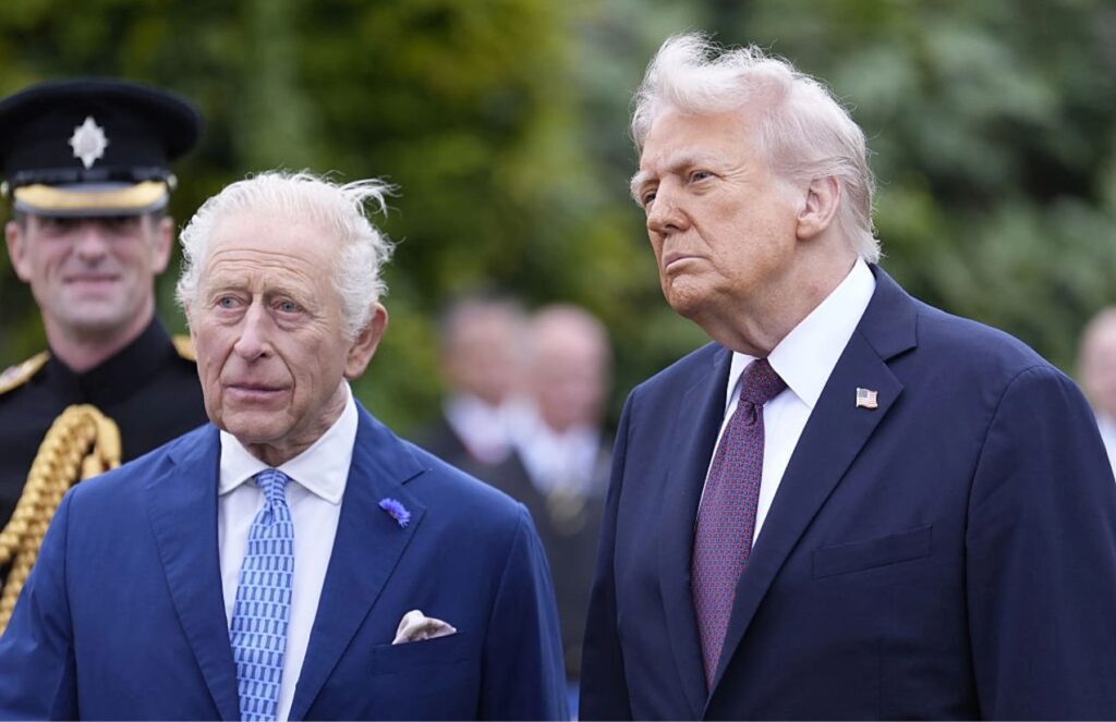 King Charles III and Donald Trump posing together for a photo.