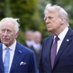 King Charles III and Donald Trump posing together for a photo.