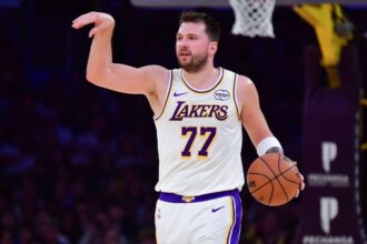Luka Dončić directing his teammates during a game to set up a play.